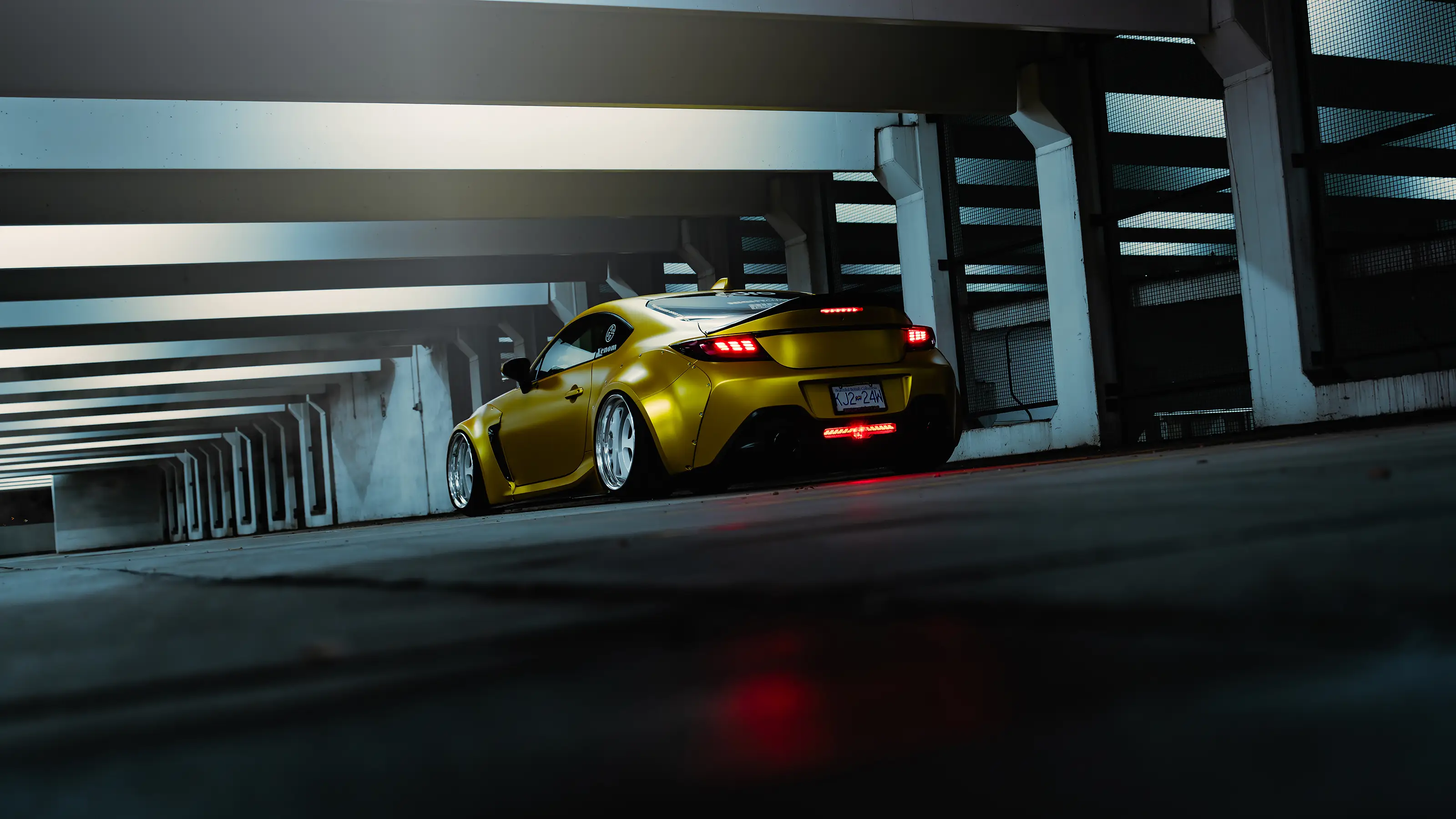 Yellow Subaru BRZ photographed at night near the waterfront