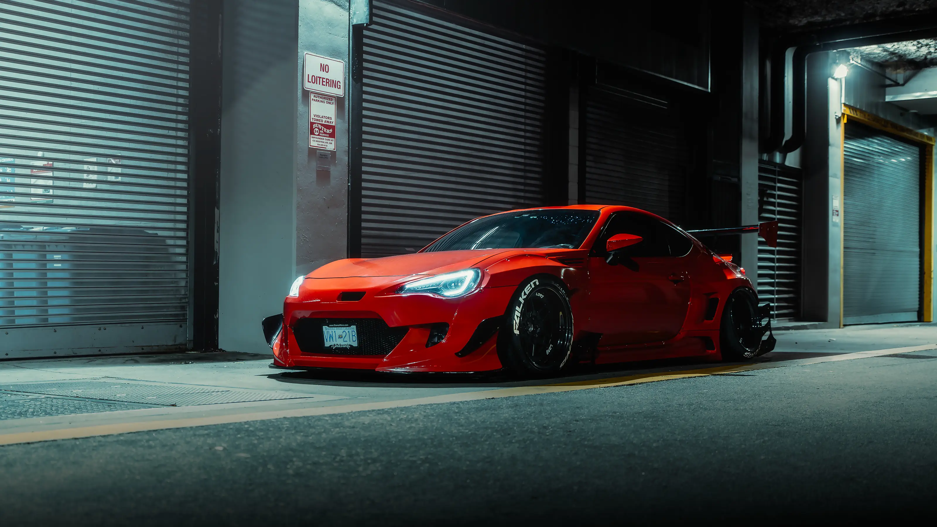 Orange widebody Toyota GT86 photographed at night